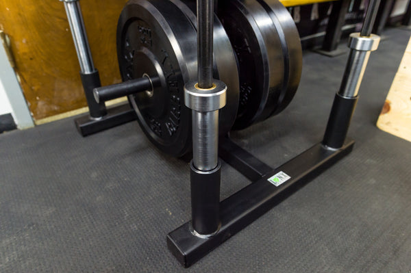 Barbell plate holder outlet